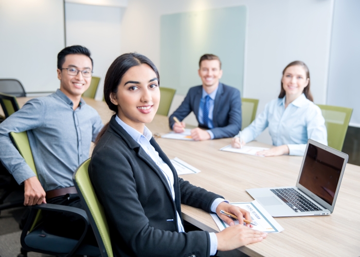 smiling-business-lady-working-with-colleagues (1)